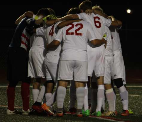 The team huddled together before they began the match.