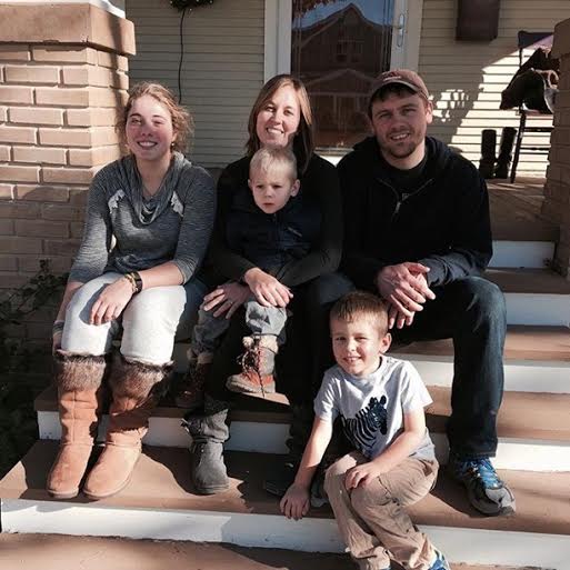 Galletti poses next to her host family