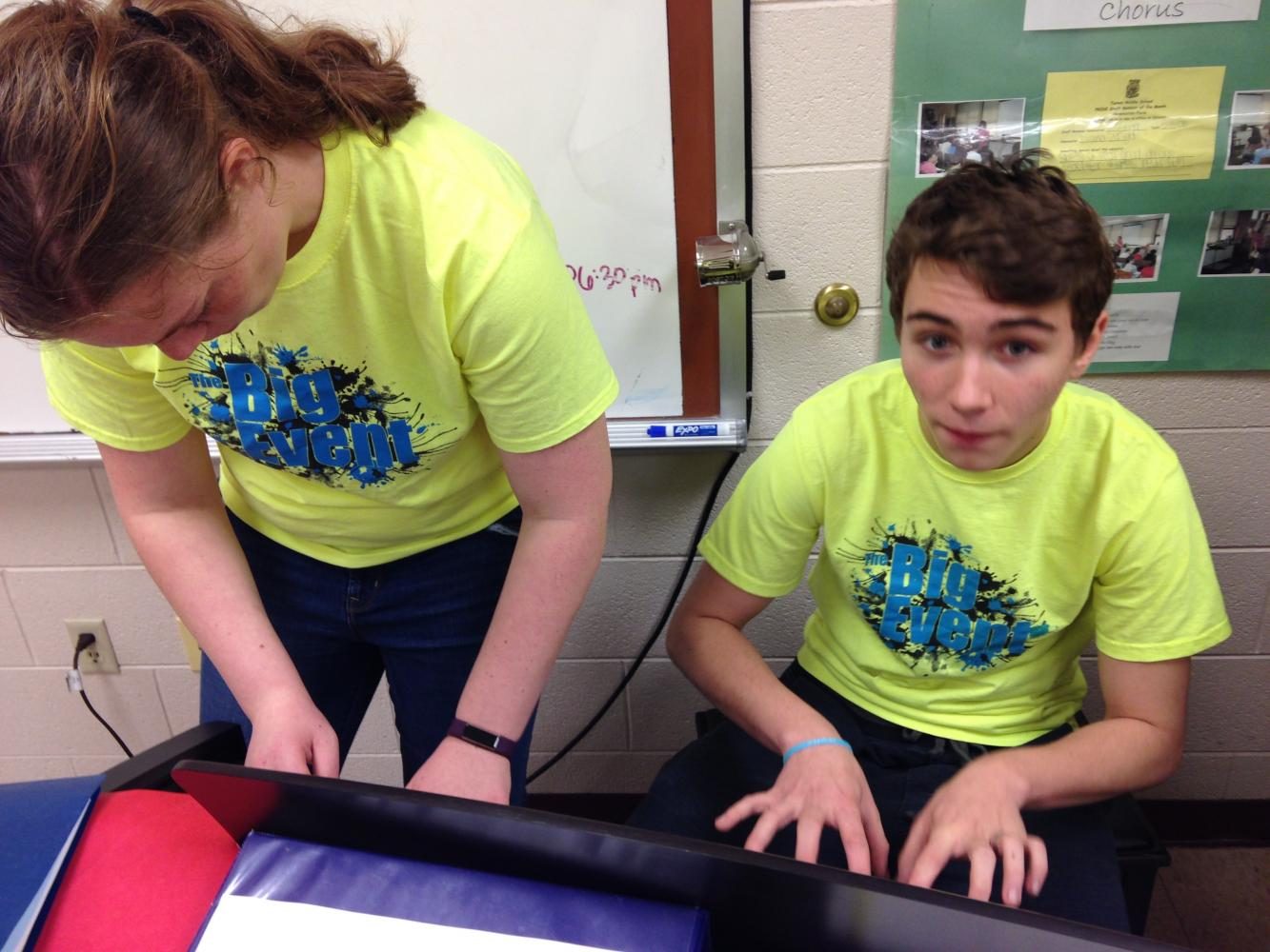 Students Megan Eisenbarth, and Drake Langshaw play piano at the Middle School.