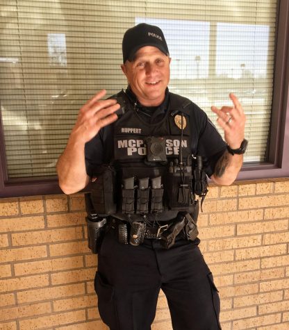 The resource officer at McPherson High School, Joey Rupert, posing his trendiest pose.