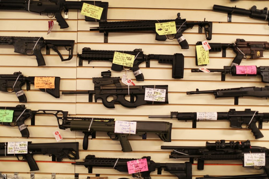 Guns+for+sale+in+a+store+on+a+wall.