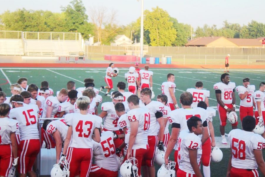 The Football team getting ready for their first scrimmage.  