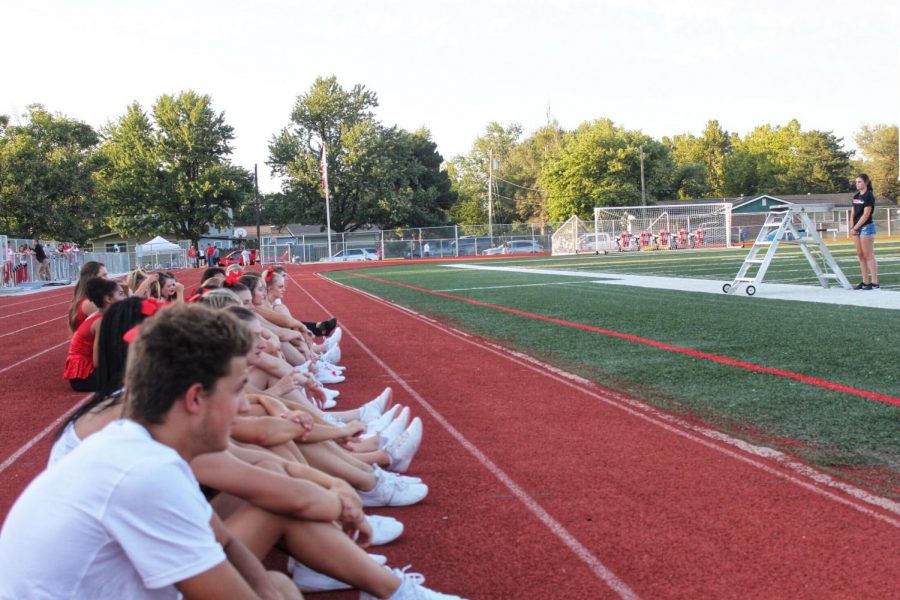 High-Steppers and Cheerleaders wait on the sidelines. 