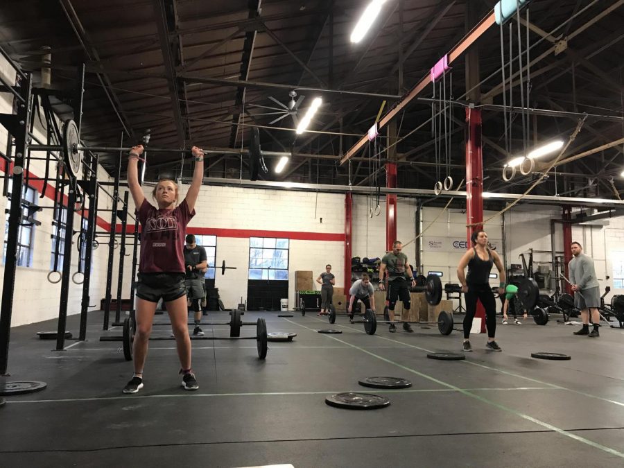 Melissa, Delilah and Robbie Mintzer exercise at Mac-Town CrossFit 