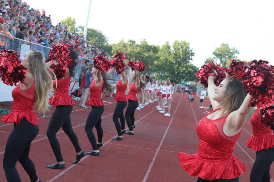 The MHS Hi-Steppers perform for the crowd at a football game.
