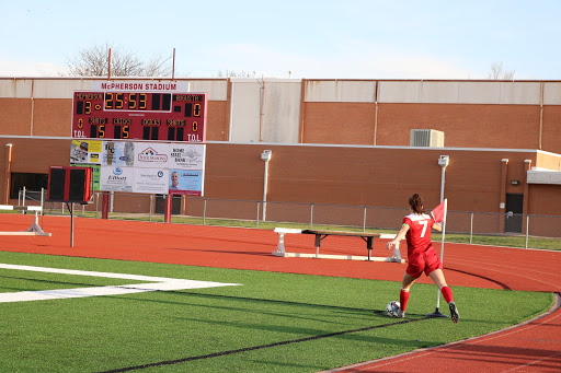 Number seven kicks the ball in.