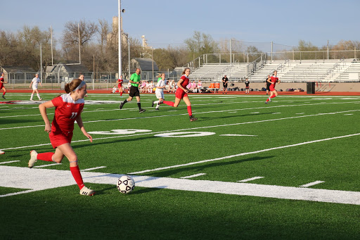 Number 11 has the ball and is heading towards the goal.