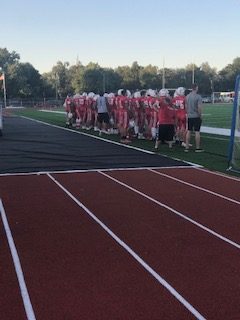 MHS football cheering on their team