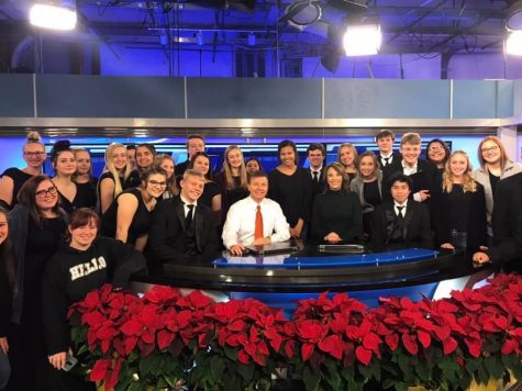McPherson High School’s Choir posing with KAKE News television hosts before pre-recording the Christmas Special.