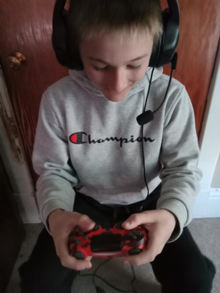 Picture of kid getting distracted by video games.