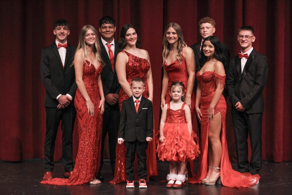 Candidates smile for a quick picture before the school wide homecoming assembly.