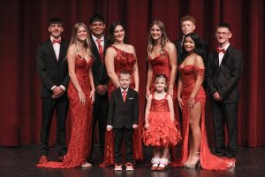 Candidates smile for a quick picture before the school wide homecoming assembly.